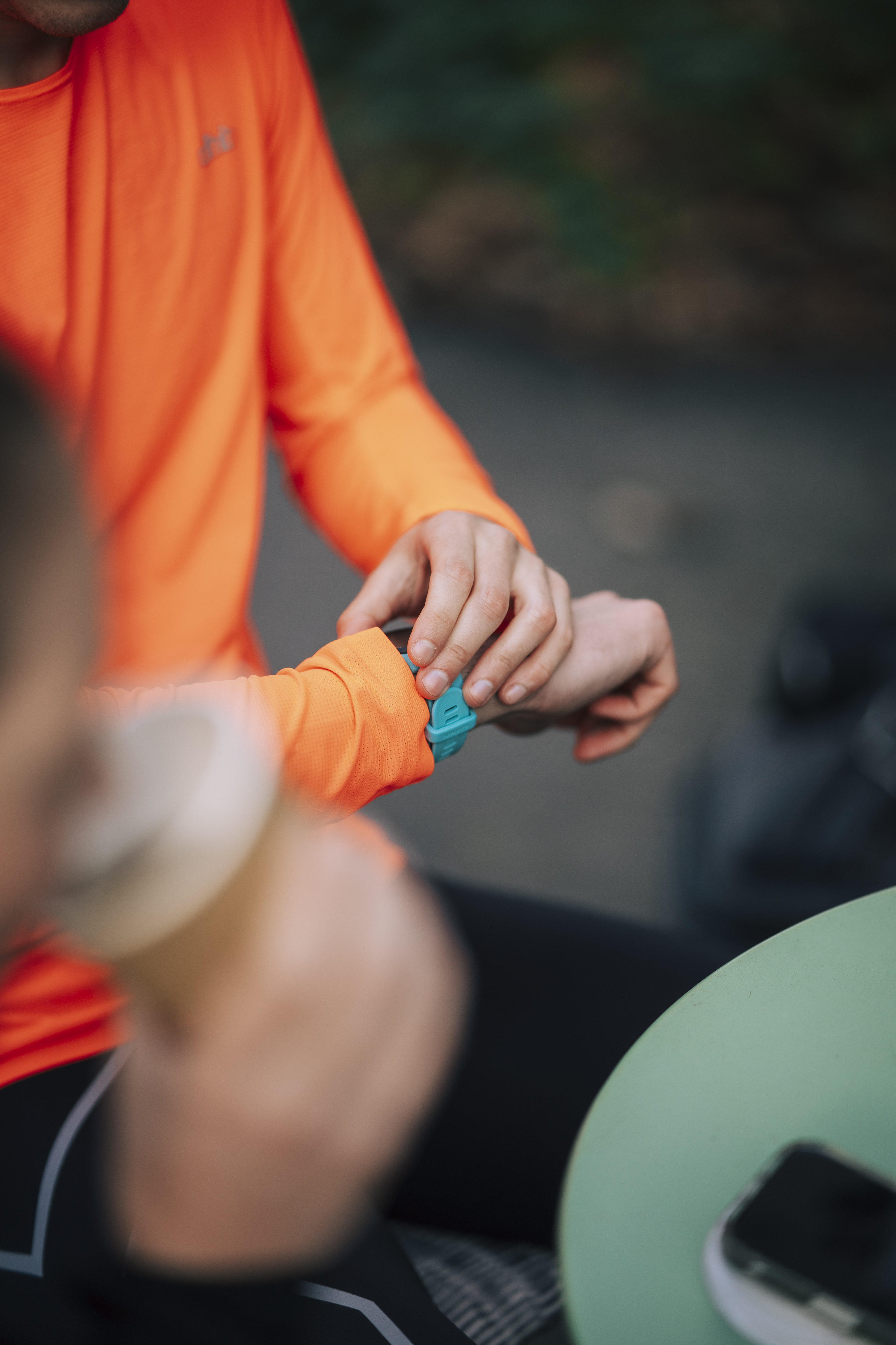 An athlete checking their sports watch before training.